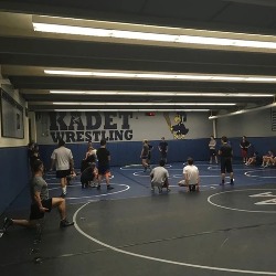 The AAHS Wrestling team practices in their dedicated area.